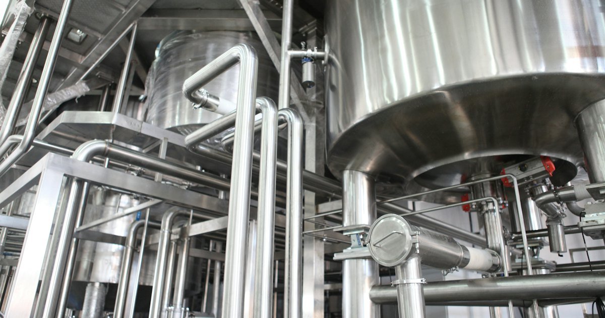 Stainless steel tanks and pipelines in a food processing plant